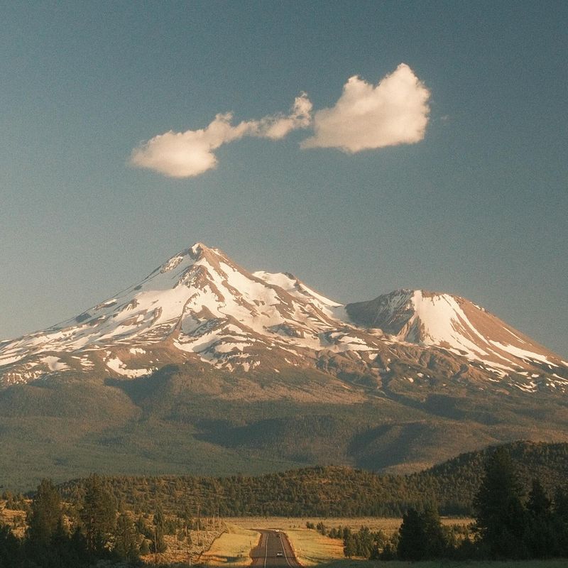 Mount Shasta at the end of a straight road. Photo by Andrew Crow