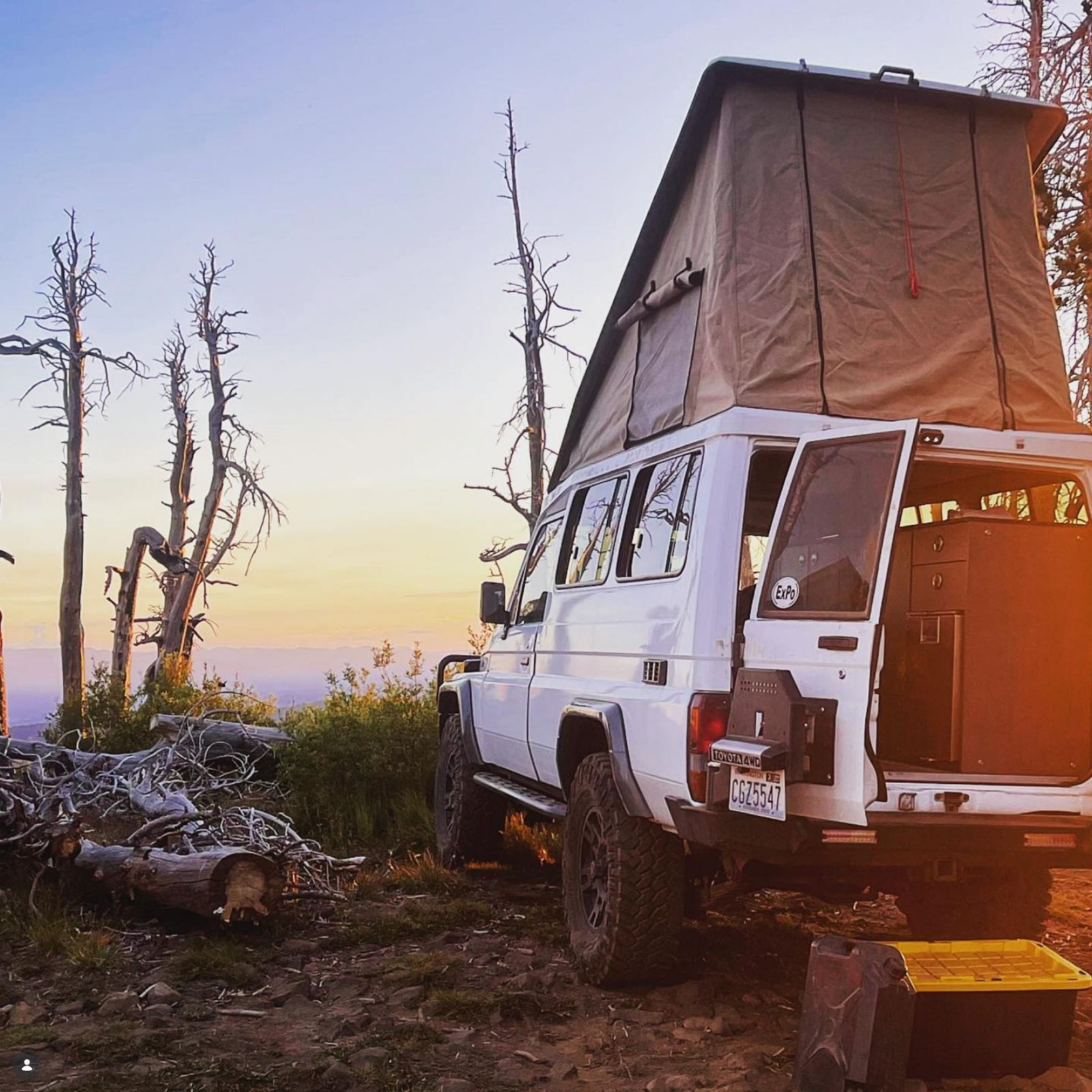 Michiel's white Toyota Troopy at a ridgeline camp