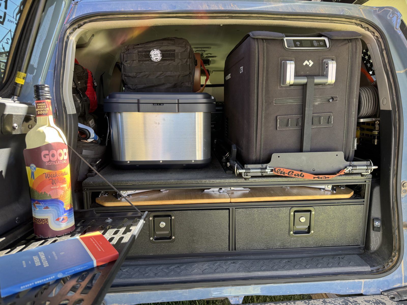 Fridge, bins and loose gear on the top, with the table slot and drawers below