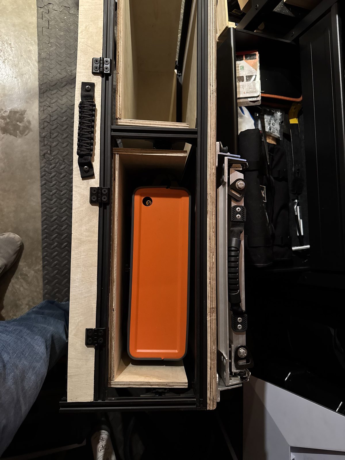 A drawer in the frame, slide mounted to the extrusion