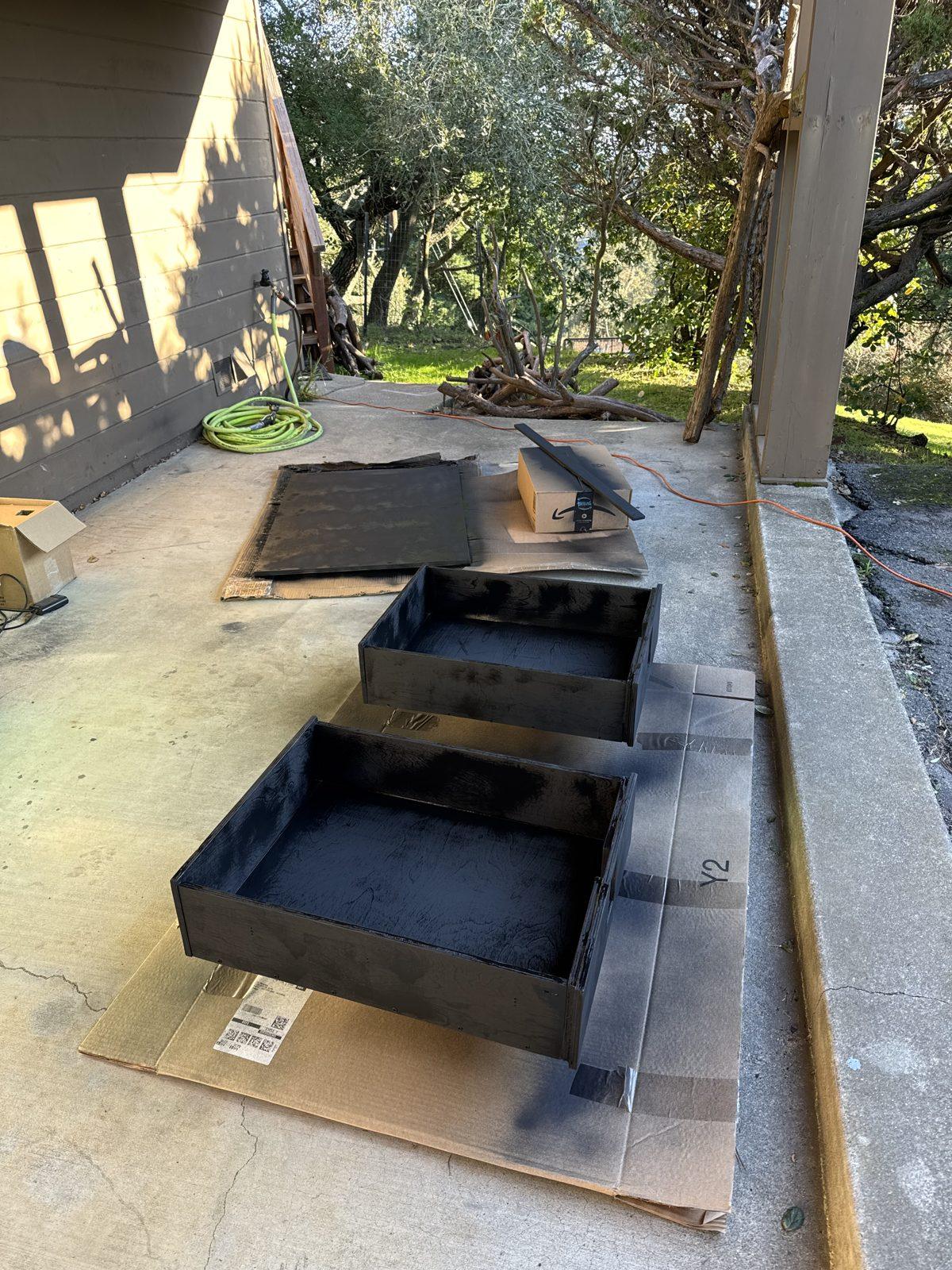 Drawer boxes and fronts drying outside after the first texture coat