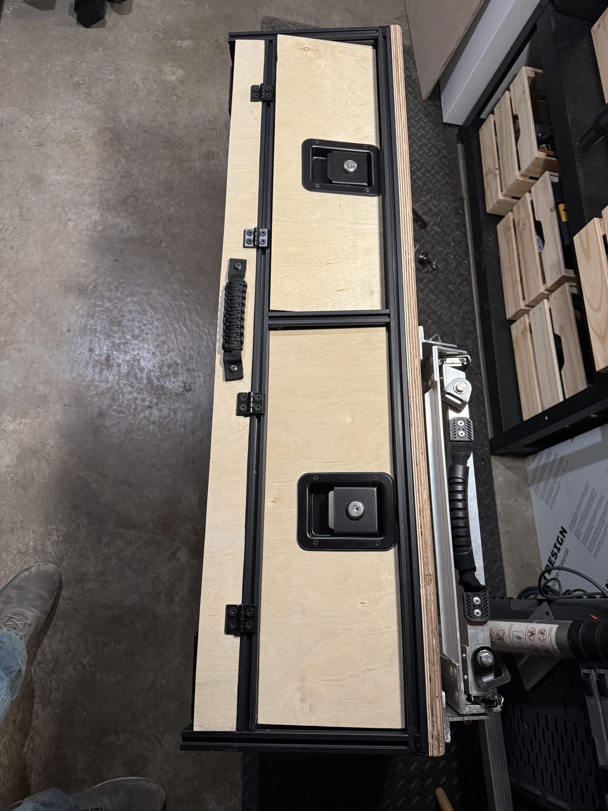 The first build's hinged flap, with its paracord pull and latches