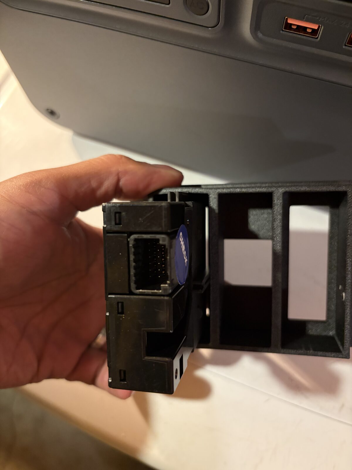 The back of a refreshing switch in the bezel, showing the twelve pins the connector has to land on