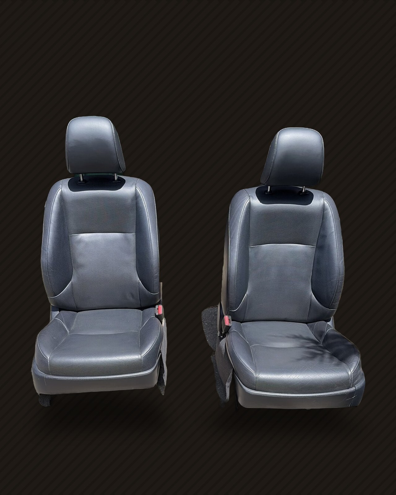 The pair of GX460 seats, cleaned up, cut out on a dark background